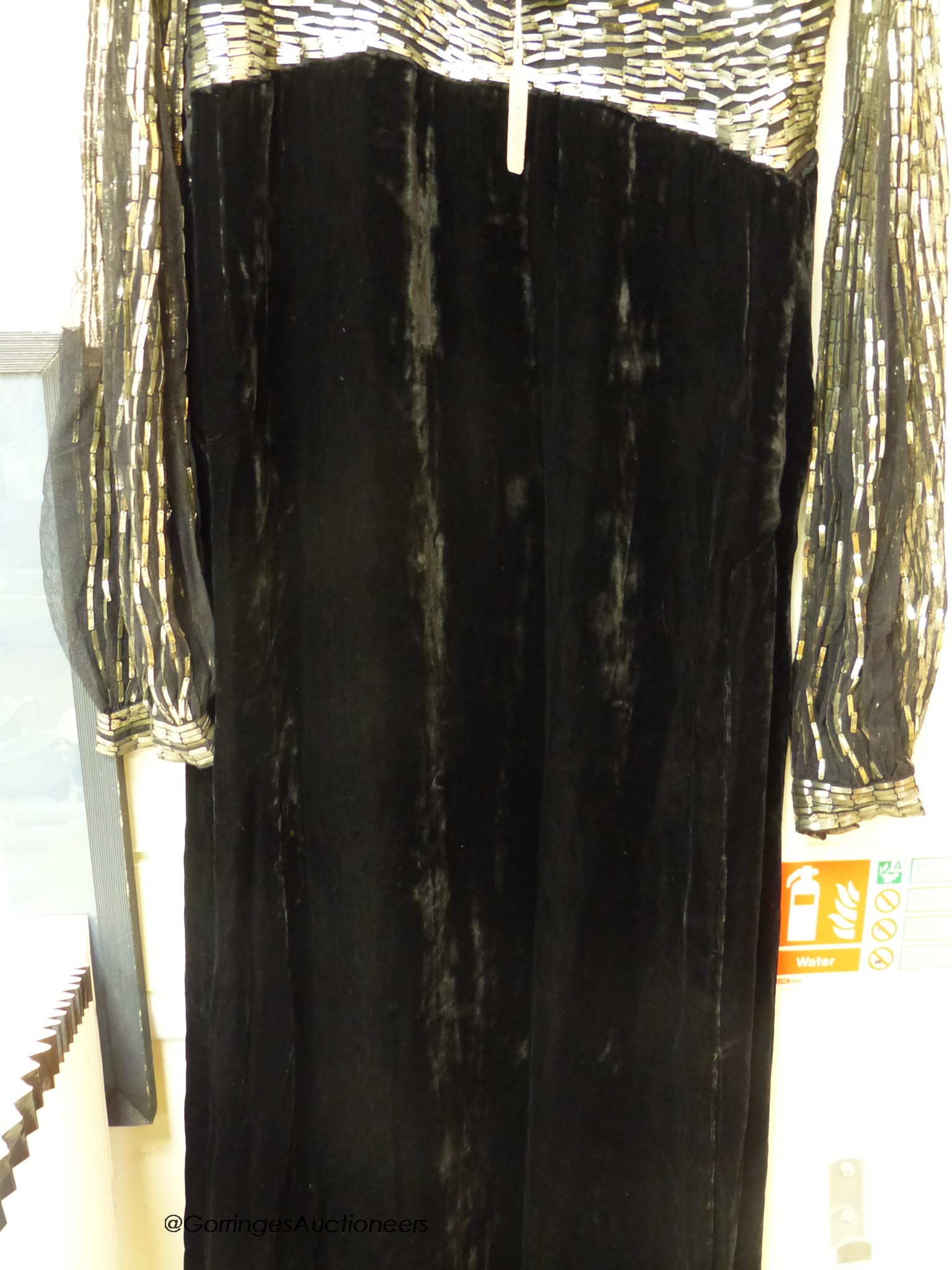 A late 1930's black silk velvet and silver evening dress and an Edwardian black sequin triangular shawl